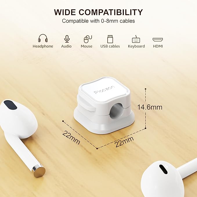 White cable management tool with compatibility icons and measurements on a wooden surface