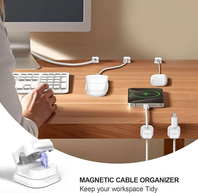 Magnetic cable organizer on a desk with computer setup